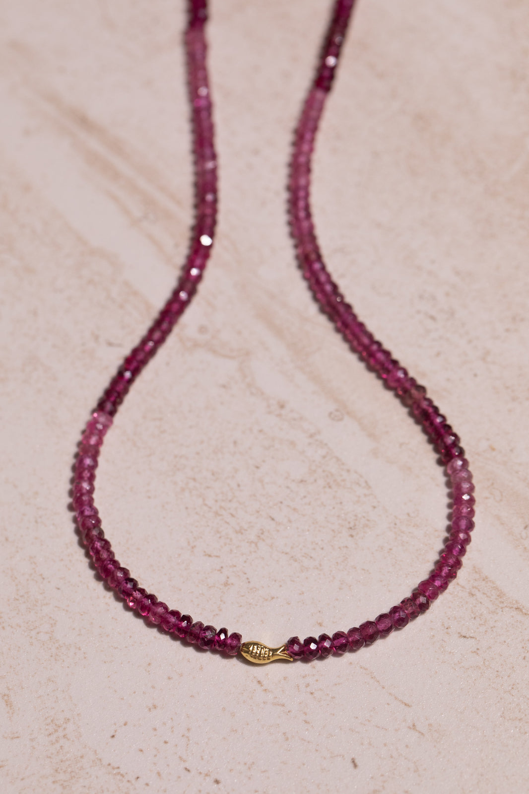 Vivid Pink Tourmaline Worry Fish Necklace 14k 17.75", a close look at the stones