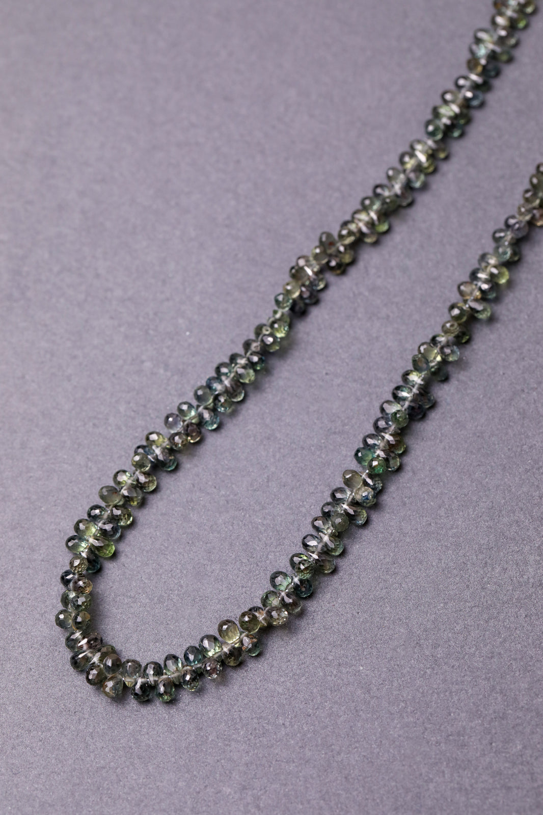 Green Australian Sapphire Teardrop Strand in 14k Gold, a close look at the stones