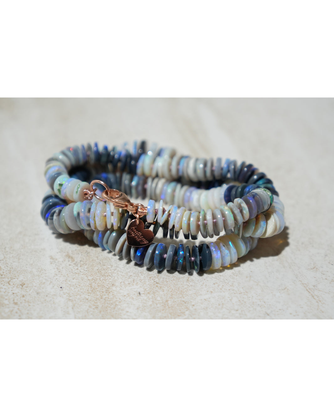 Lightning Ridge Australian Black Opal Strand in 14k Rose Gold, a close look at the stones