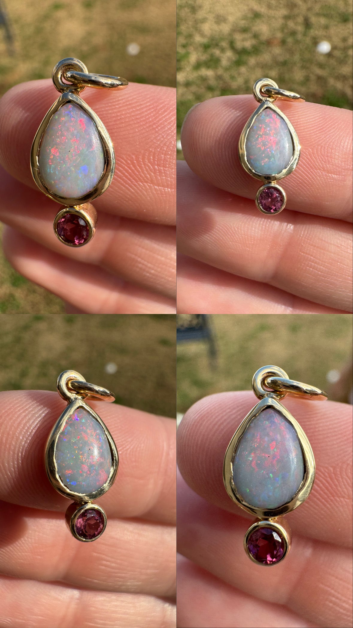 Gold pendant with opal stone and red gemstone held between fingers against a blurred outdoor background