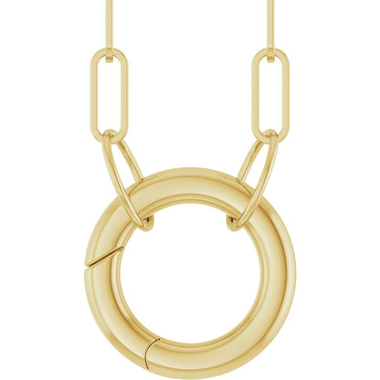 Gold necklace with a circular pendant on a white background